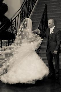 bride and groom dance at stairs