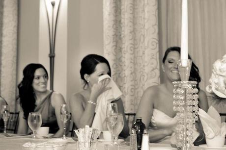 bridesmaids laugh at wedding toast