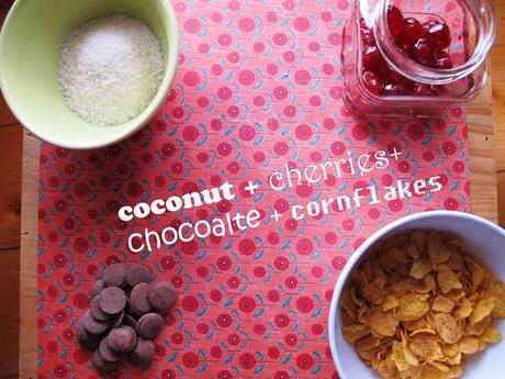 Coconut, chocolate, cherries and cornflakes on a table
