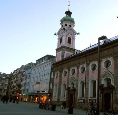 A pink historic church in Innsbruck, Austria is just one of many romantic buildings found in the old town.