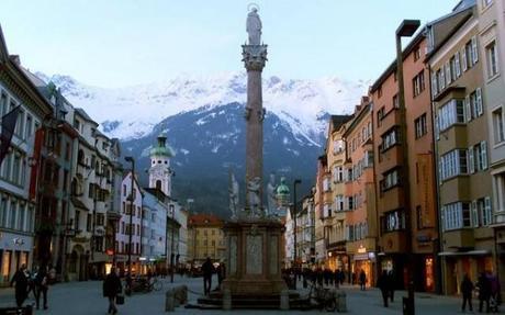 The Old Town in Innsbruck, Austria is surrounded by mountains, making for a romantic setting.