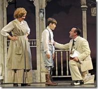 Paramount Theatre’s production of The Music Man, directed by Rachel Rockwell, features (from left) Mary Ernster as Mrs. Paroo, Johnny Rabe as Winthrop Paroo and Stef Tovar as Harold Hill.  (photo credit: Liz Lauren)