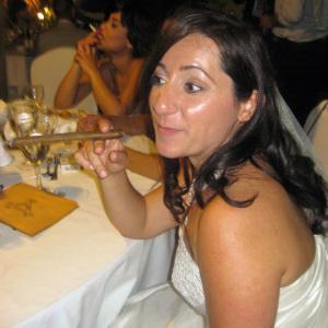 My beautiful sister in law, the only bride I've seen smoking a fat cigar in her wedding gown