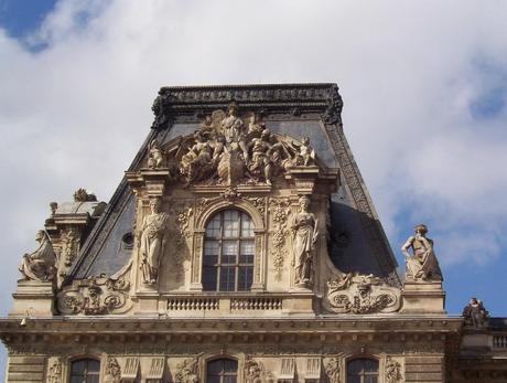 Louvre - stone carvings above windows - Paris - France
