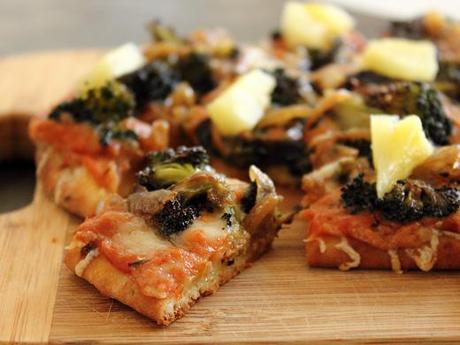 Flatbread Pizza with Roasted Red Pepper Sauce, Broccoli, Caramelized Onions, and Pineapple