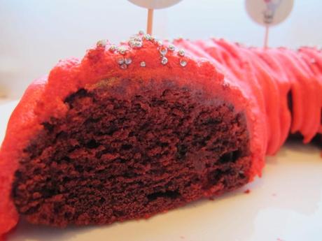 The red velvet cake sliced to show the red inside