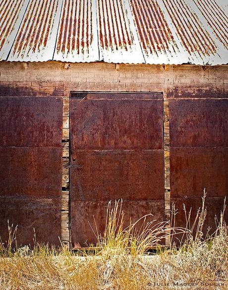 three sliding barn doors rusted to a beautiful russet patina