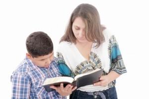 son and mother reading