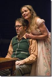 ) Meg (ensemble member Moira Harris) sings a tune for Stanley (ensemble member Ian Barford) on his birthday in Steppenwolf Theatre Company’s production of The Birthday Party by Harold Pinter, directed by ensemble member Austin Pendleton. 