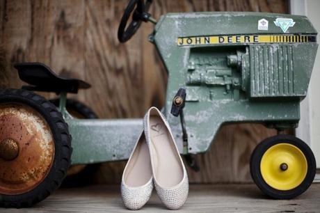 wedding shoes next to toy tractor