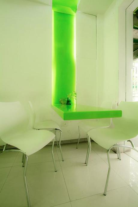 Modern dining room with neon green lighting