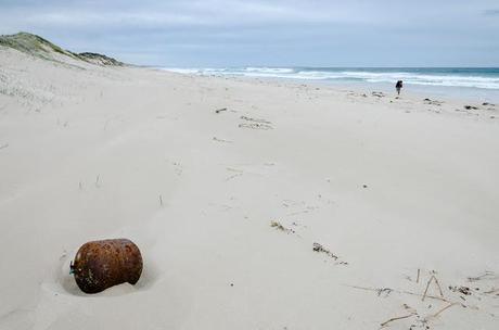 gas bottle lying on beach
