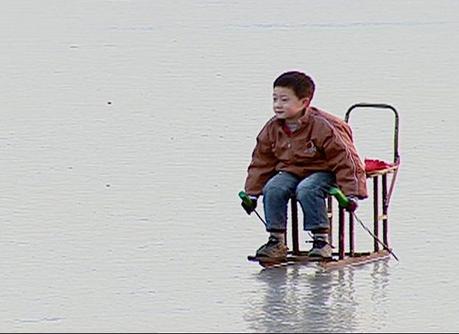 Little boy on sled in Bejing - China