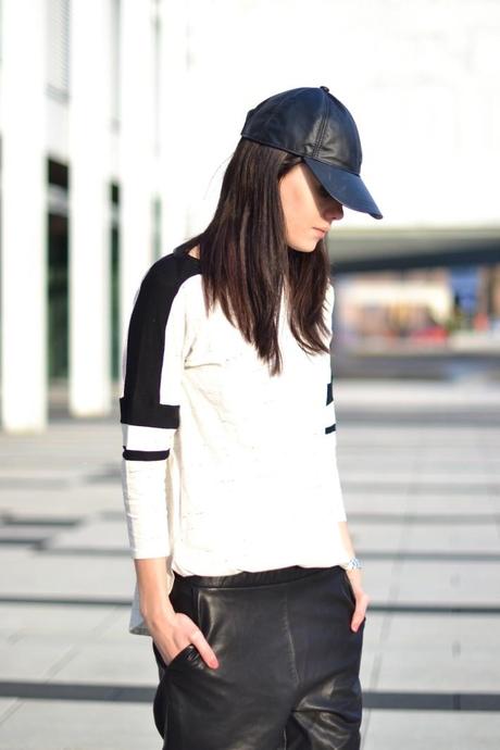 Sports chic leather cap look