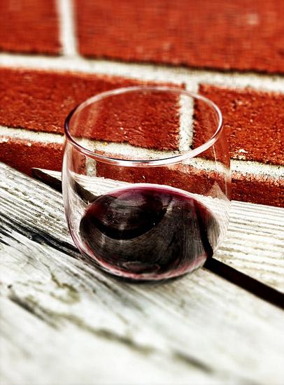Glass of wine on a wooden table