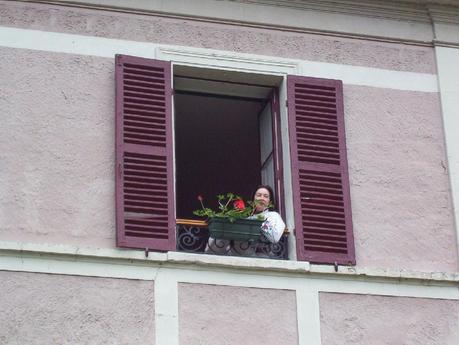 Jean looking out from our hotel room window in Giverny, France
