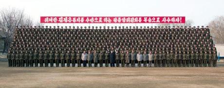 Kim Jong Un poses for a commemorative photograph with members of KPA Unit #323 (Photo: Rodong Sinmun)