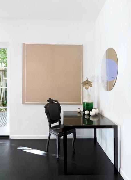 Dining room with black Smoke chair and Hella Jongerius vase