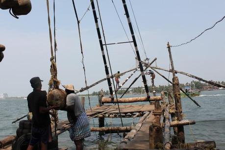 A team of fishermen operate the net. (Venus Upadhayaya/The Epoch Times)