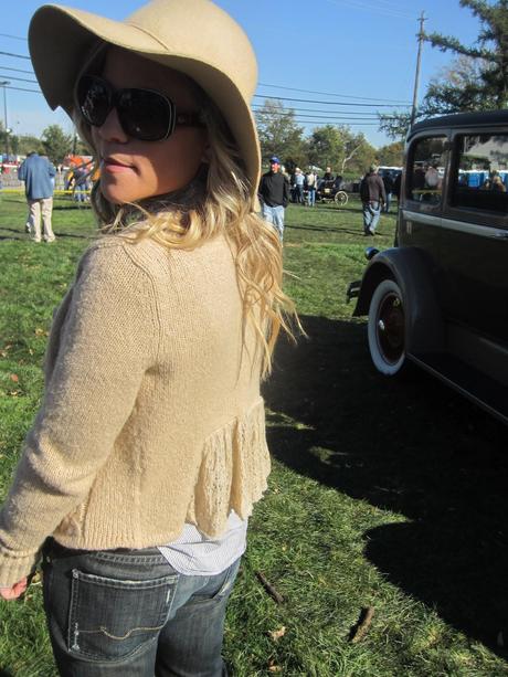 A Wide Brim Hat and a Antique Car on a Crisp Fall Day