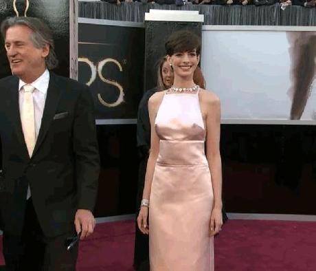 hulu:

Pretty in pink Anne Hathaway doing her best pageant wave on the red carpet.

BARF.