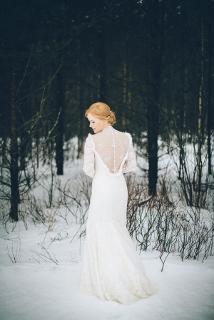 back of bride's wedding dress in snow, long sleeve dress