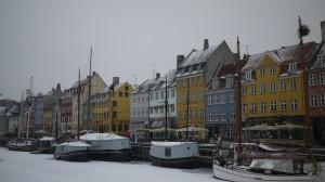canal lined with candy-coloured buildings Nyhavn Copenhagen