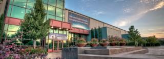 The exterior of the National Ignition Facility, a ten-story building the size of three football fields, is pictured at sunset. NIF is the world's largest and highest-energy laser system and the nation's largest scientific project. It is located at Lawrence Livermore National Laboratory in northern California. (Credit: Lawrence Livermore National Security)