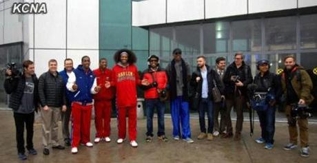 Dennis Rodman (6th R), members of the Harlem Globetrotters and a film crew from VICE Media Group poses for a commemorative photograph at Pyongyang Sunan Airport after their arrival on 26 February 2013 (Photo: KCNA)