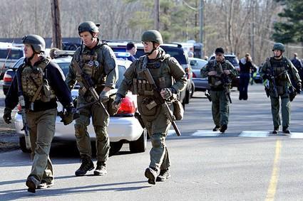 State Police are on scene following a shooting at the Sandy Hook Elementary School in Newtown, Conn., about 60 miles (96 kilometers) northeast of New York City, Friday, Dec. 14, 2012. 
