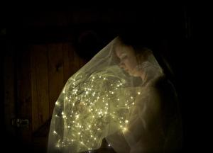 This is a self portrait that I took last summer...I like to live in my own bubble of pretty things and fairy lights, because that's what makes me happy. 