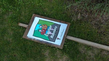 caution runners sign lying on ground