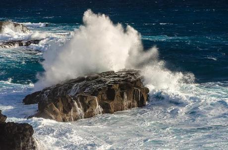 waves breaking on rock outcrop
