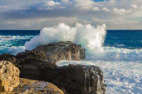 waves breaking on rock outcrop