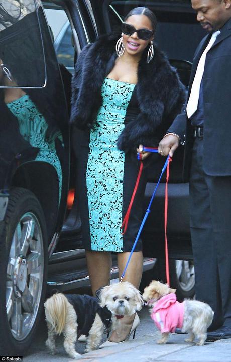 Ashanti out and about in New York City walking her dogs wearing...