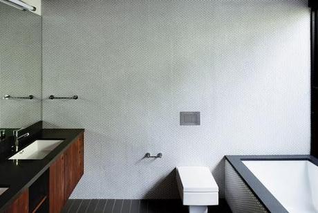 modern bathroom with white penny tiles