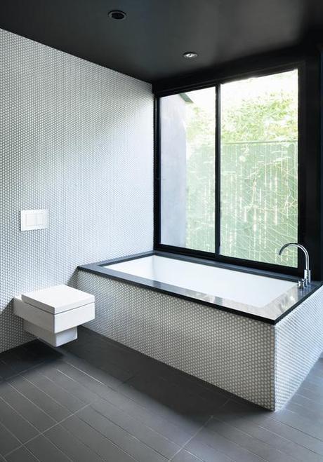 modern bathroom with white penny tiles