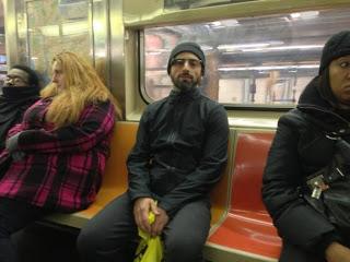 Picture of Brin wearing google glasses on NYC subway.