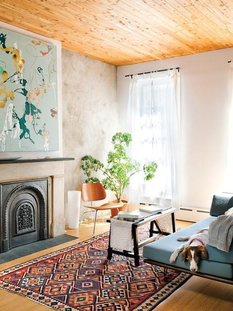 Creative living room with an Eames chair and decorative rug