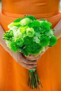 green flowers orange dress bridesmaids