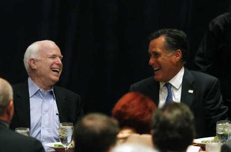 U.S. Senator John McCain (R-AZ) (L) and U.S. Republican presidential candidate and former Governor of Massachusetts Mitt Romney share a laugh before addressing the Republican National Committee State Chairman's National Meeting in Scottsdale, Arizona Apri