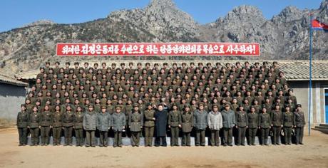 Kim Jong Un (front row, 12th L) poses for a commemorative photograph with service members and officers of the long-range artillery unit subordinate to KPA Unit #641 (Photo: Rodong Sinmun)