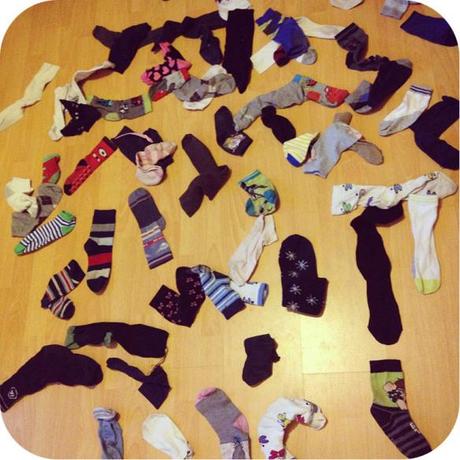My dearest husband sorting out the year-old pile of odd socks that I've been collecting/hoarding. 
