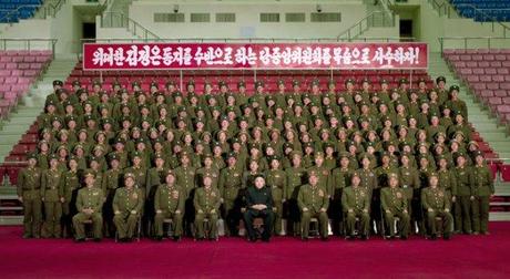 Kim Jong Un (C, seated) poses for a commemorative photograph with KPA service members and officers from island defense units who participated in live fire exercises in the West (Yellow) Sea on 13 March 2013 (Photo: Rodong Sinmun)