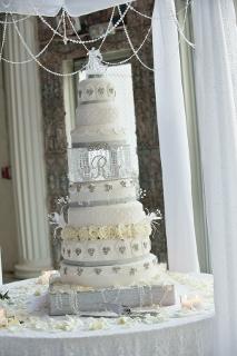 three tiered white wedding cake