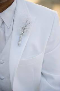 white suit boutonniere on groom