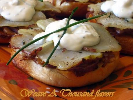 Bagel Pizzas with Caramelized onions, Roasted Potatoes & Herbs topped with a faux Goat Cheese Creme Fraîche