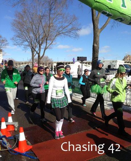 Crossing the finish line, surrounded by other runners!