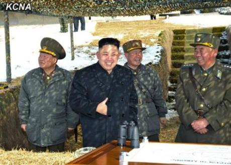 Kim Jong Un (2nd L) smiles after the first phase of live fire anti-aircraft drills (Photo: KCNA)