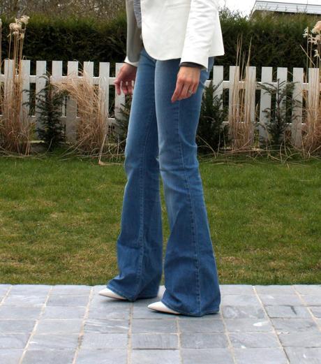 The flare jeans and the white wedge shoes